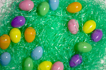 plastic Easter eggs and green Easter grass 