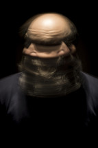blurry bearded mature man head shot 