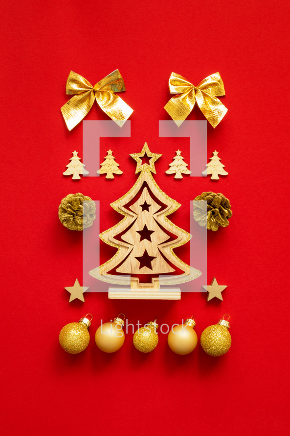gold Christmas ornaments on red 