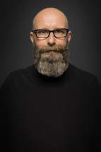 portrait of a bearded man with glasses 