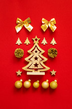 gold Christmas ornaments on red 