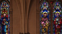 religious scenes on inside church stained glass windows