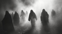 Mysterious silhouettes of a group of people in the fog.