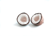 two halves of coconut isolated on a white background with empty place for text