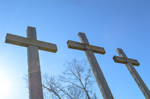 three crosses against a blue sky 