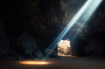 Resurrection. Interior of a cave with light rays.