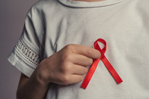 wearing a red ribbon 