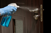 Hand In Protective Glove Cleaning Inside Door Handle