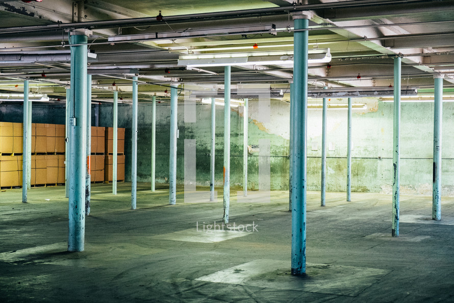 support posts in an empty warehouse 