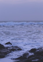 waves in the ocean and rocks along a shore 