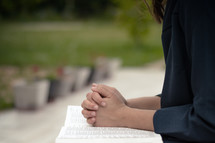 A young woman is praying and worshiping in the evening.
