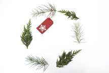 pine branches forming a simple wreath frame 