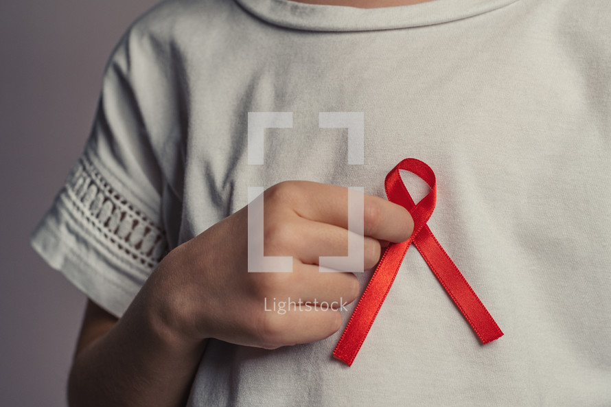 wearing a red ribbon 