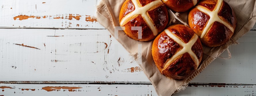 Easter. Good Friday. Hot cross buns on a white wooden background. Top view.