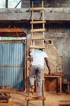 a man walking down a ladder 