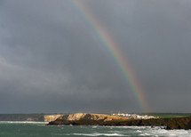 rainbow at a shore 