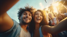 Couple of friends having fun and taking selfie with smartphone