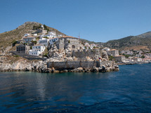 homes built onto cliffs of an island 