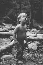 toddler boy exploring outdoors 