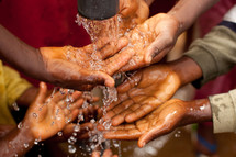 washing hands with clean water in Africa 