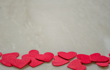 red heart cutouts on a white background 