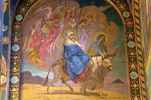 Mosaic of Joseph and Mary and baby Jesus riding on a donkey, the flight into Egypt