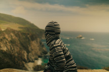 A boy with a hoodie overlooking the world | Dreams | Vision | Next generation 