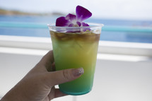 a tropical cocktail on a beach 