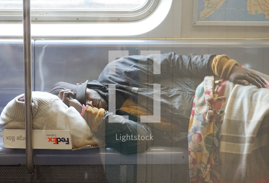 a man sleeping on a train 