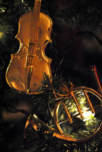 Christmas tree ornaments; violin and French horn.