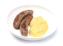 Bangers and Mash or Sausage and Mashed Potatoes in a White Plate