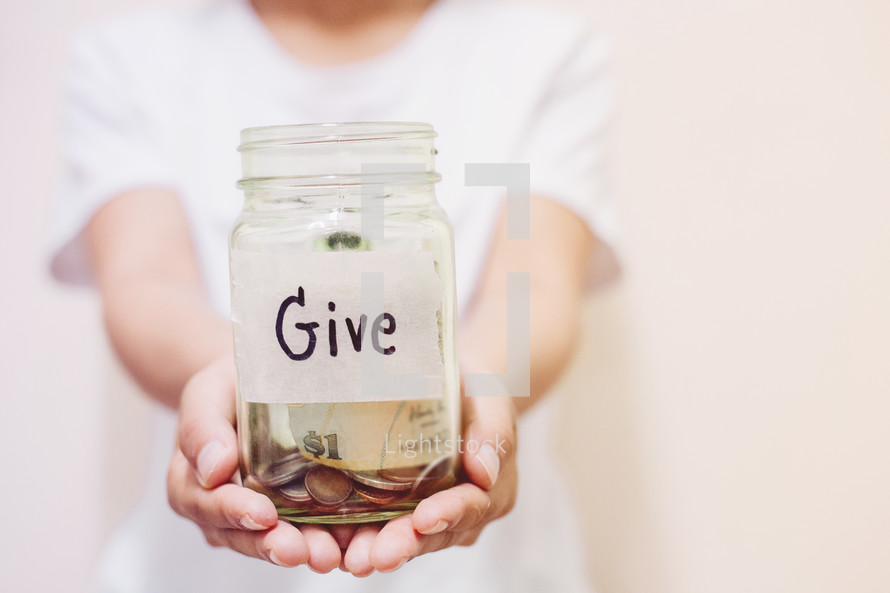 Cupped hands holding a giving jar — Photo — Lightstock
