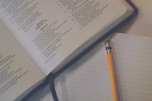 Psalm 107 and notebook and pencil 