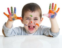 toddler with paint on his hands 