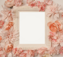 pink flowers around a white frame 