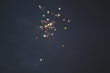 sparks from fireworks in a night sky 