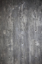 holes in a wood floor