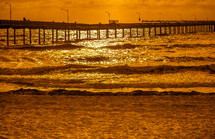 beach pier at sunset 