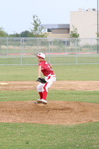 a young pitcher throwing a baseball 