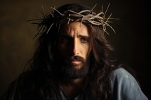 Jesus Christ with crown of thorns on his head. Dark background.