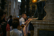 People Touching the Feet of St. Peter's Statue in St. Peter's Basilica