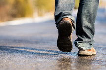 feet walking on pavement 