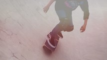 Multiple shots of a kid on a skateboard.