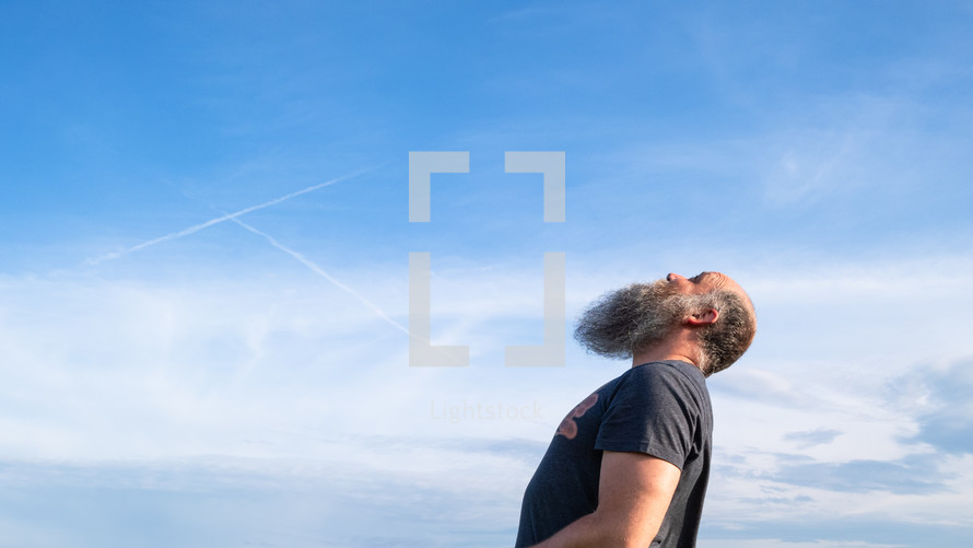 a man looking up at the sky 