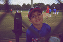 little boy at a baseball game
