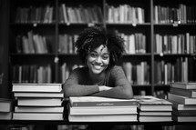 Bible Study. Happy african american female student in library, black and white