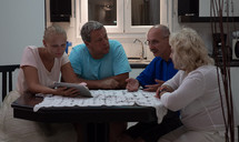 family talking around the kitchen table 