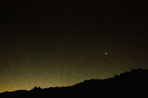 crescent moon above Mauna Kea 
