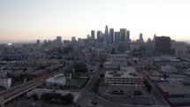 Financial skyscrapers. Business district with skyscrapers. Rising drone shot from residential buildings. Aerial view of cityscape. Urban aerial view of beautiful and scenic downtown Los Angeles. 