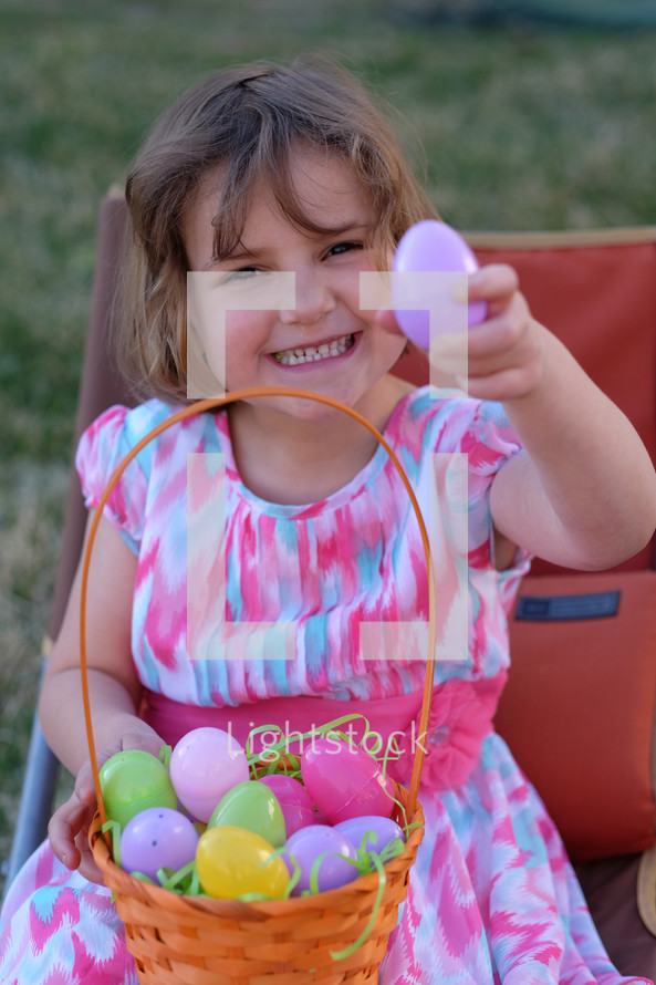 a girl child with an Easter basket 